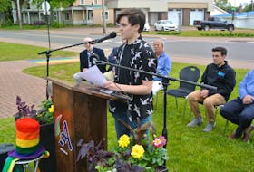 Mason Carter speaks during the recent Pride flag-raising ceremony in Amherst.