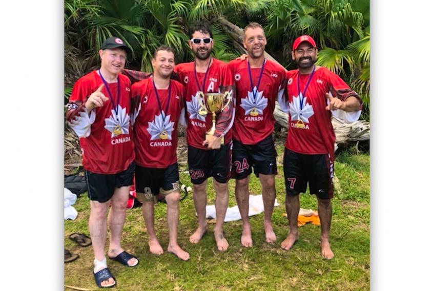The five Newfoundlanders who were part of Canada’s gold-medal winning entry at the world masters men’s ball hockey championship in Pembroke, Bermuda pose with their medals and the championship trophy after their victory in Sunday’s final. Pictured (from left) are Jamie Tobin, Jeremy Bishop, Terry Ryan, Harold White and Peter Cabral. As well, Susan Stuckless of Herring Neck was one of the leading scorers for the Canadian masters women who also claimed a world championship Sunday in Bermuda. — Submitted/Steve Power