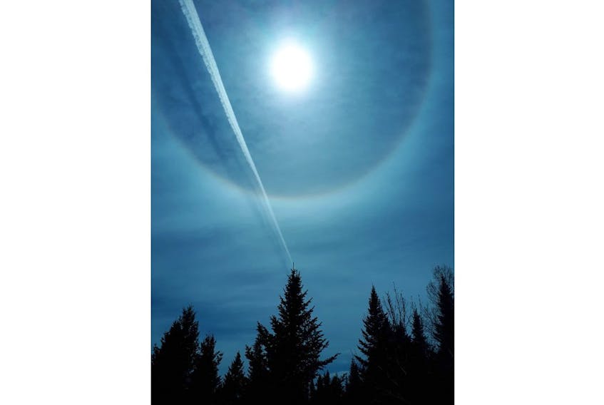 Cathy Foley spotted the solar halo and condensation trail from the top of Halls Harbour Mountain, N.S. -