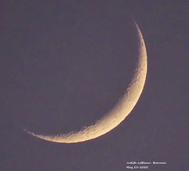 Judy LeBlanc-Brennan was out in Florence Cape Breton Monday evening and took this amazing photo of the crescent moon. The moon was just a few days past its new phase; the New Moon was on Friday, May 22nd.  A new moon occurs when the moon is between the sun and Earth, and the two bodies share the same celestial longitude.
