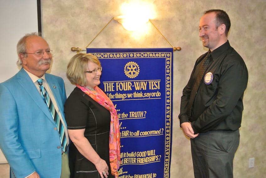 Amherst Mayor David Kogon talks to Deputy Mayor Sheila Christie and Rotary president David McNairn following his annual address to the Amherst Rotary Club on Monday.