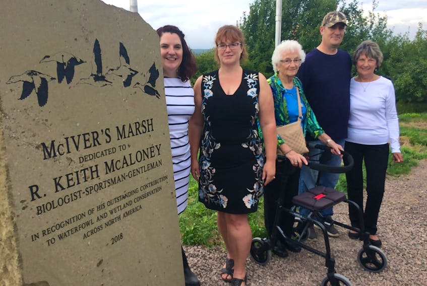 Members of Keith McAloney’s family, including (from left) daughters Kaitlin and Andrea Atwell, his mother Helen, son Brent and wife Sandy look over a monument that was unveiled in his memory at the McIver Marsh in Strathcona near River Hebert on Thursday.