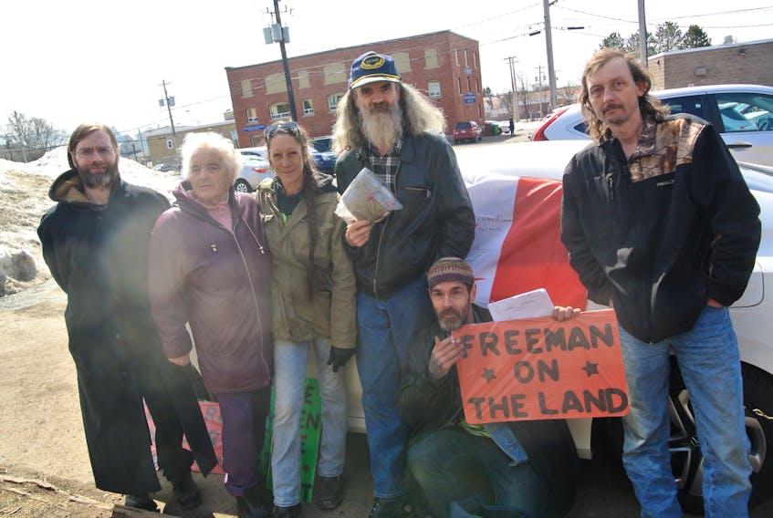 Supporters of the long-haired, bearded marijuana advocate Daren McCormick [centre] travelled from as far away as Ontario to raise their voice for charges against the Northport man to be dropped.