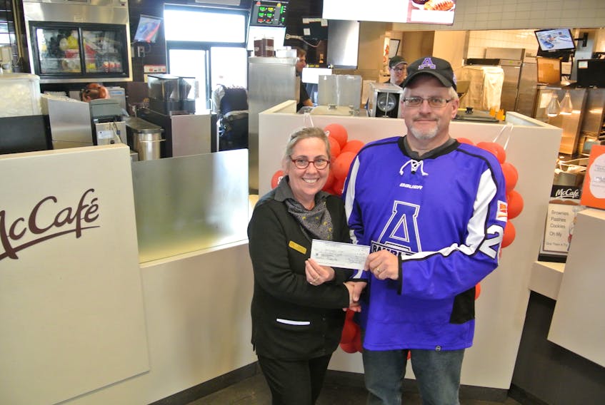 The Amherst CIBC Wood Gundy Ramblers were just one of the many organizations that came out to show their support for the Ronald McDonald House during the annual McHappy Day. Store manager Donna Hunter accepted a donation from team treasurer Allan Chapman during the one-day fundraiser on May 2.