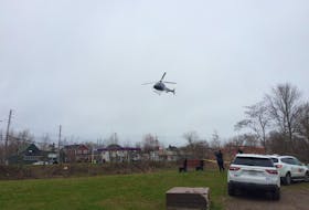 A helicopter joins the search for missing three-year-old Dylan Ehler in Truro on Thursday, May 7, 2020.