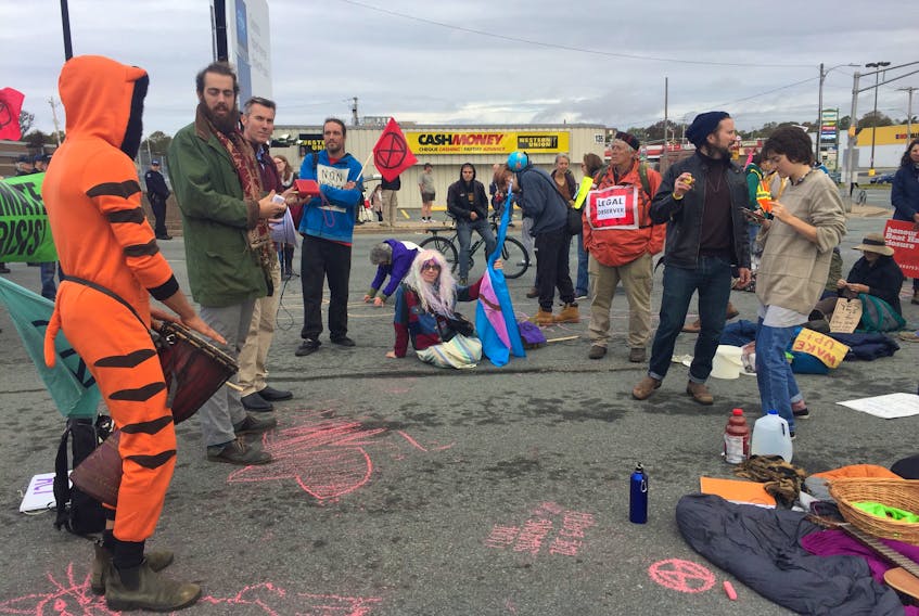 Climate crisis protesters block the entrance to the Macdonald bridge on the Dartmouth side Monday, Oct. 7, 2019. - Nicole Munro