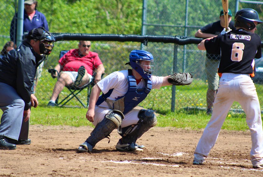 Amherst Athletics’ catcher Cole Stevens receives a ball in Bluenose Midget AA League action June 8 in Stellarton. The Athletics won both games of the doubleheader. Tanya Tuttle-Comeau photo