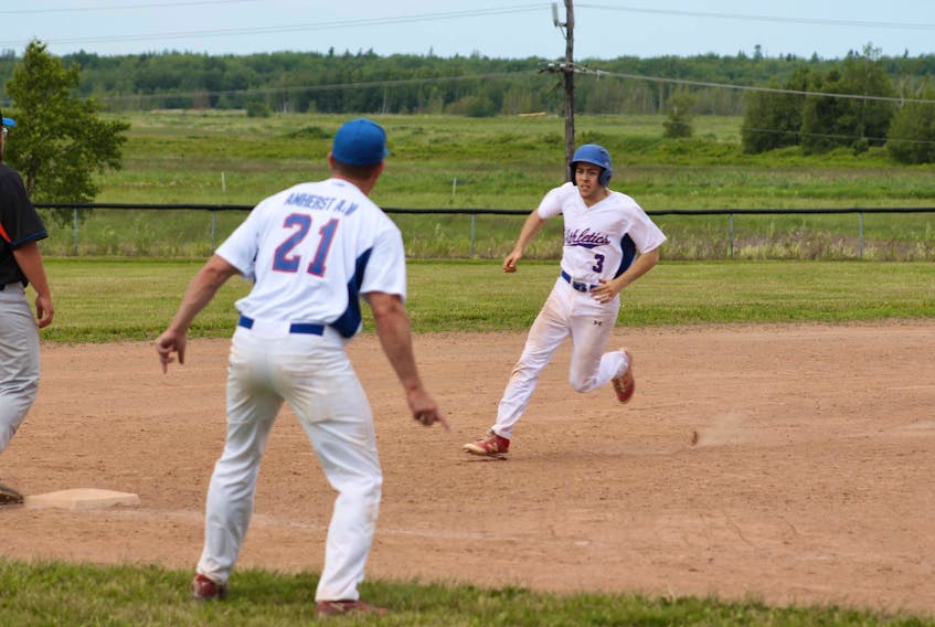 Amherst Athletics baserunner Michael Farrell gets waved toward home plate by coach Jeff Hoeg in recent Bluenose Midget AA Bluenose League action. Amherst won both games of the doubleheader.