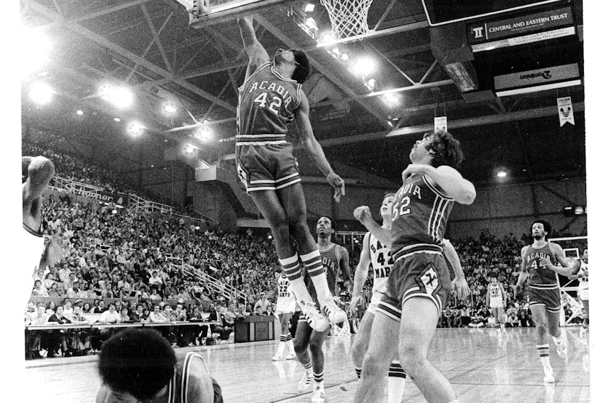 Mike Hazard leaps for a rebound against Saint Mary's at the Halifax Metro Centre. (Nova Scotia Sport Hall of Fame)