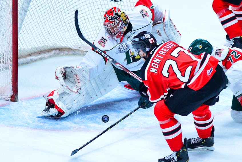 Halifax Mooseheads goalie Alexis Gravel makes a save on Quebec Remparts forward Gabriel Montreuil during Tuesday’s QMJHL playoff game at the Centre Videotron in Quebec City.