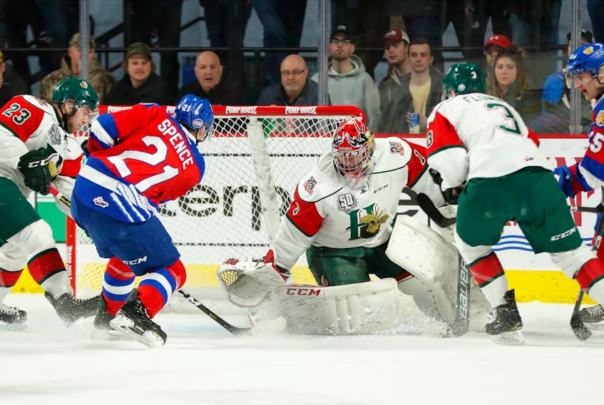 Halifax Mooseheads goaltender Alexis Gravel makes a save on Moncton Wildcats defenceman Jason Spence during Tuesday’s QMJHL playoff game at the Avenir Centre in Moncton.