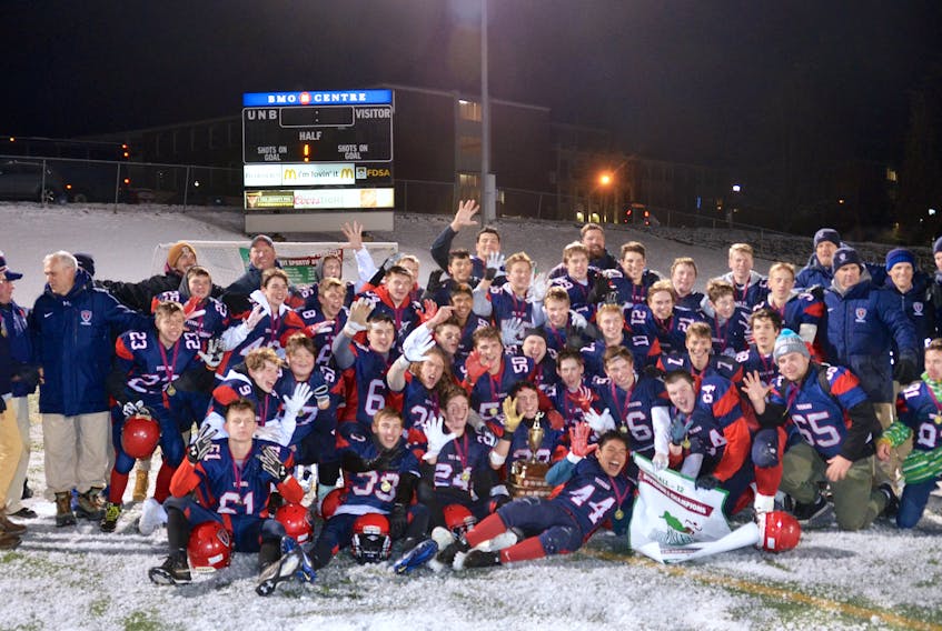 Members of the 2019 Tantramar Titans celebrate their fifth consecutive provincial championship Saturday evening in Fredericton. Sackville downed the Riverview Royals 23-13 for the win.