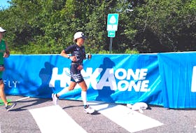Silvy Moleman is shown running during an Ironman triathlon.