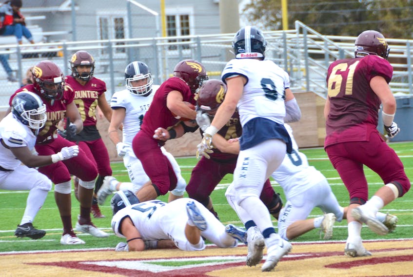 Sackville’s own Jack Estabrooks has emerged as a major offensive weapon for the Mounties, notching 188 yards on 35 attempts from the tailback position in Friday’s away game against the St. Mary’s Huskies. Above, Estabrooks  is shown running the ball in Mount Allison’s Sept. 28 win over the X-Men.