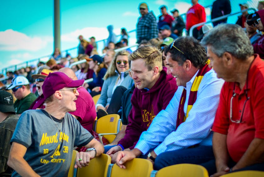 New Brunswick Liberal leader Brian Gallant, centre, seen here at a recent Mount Allison football game with Liberal MP Dominic LeBlanc and recently-ousted MLA Bernard LeBlanc, will have the first opportunity to govern the province and to try and gain the confidence of the house.
