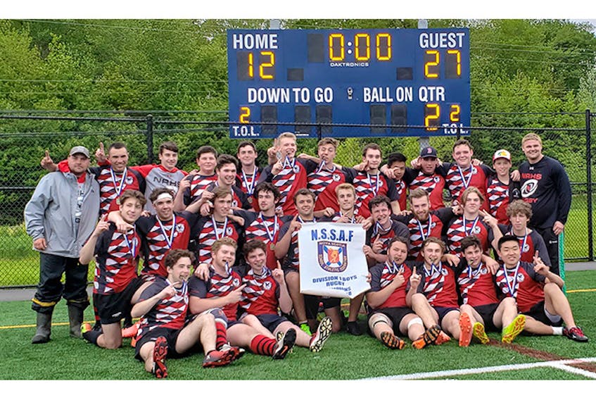 The picture tells the story: the NRHS Nighthawks are shown after winning the school’s first provincial rugby title on Saturday.