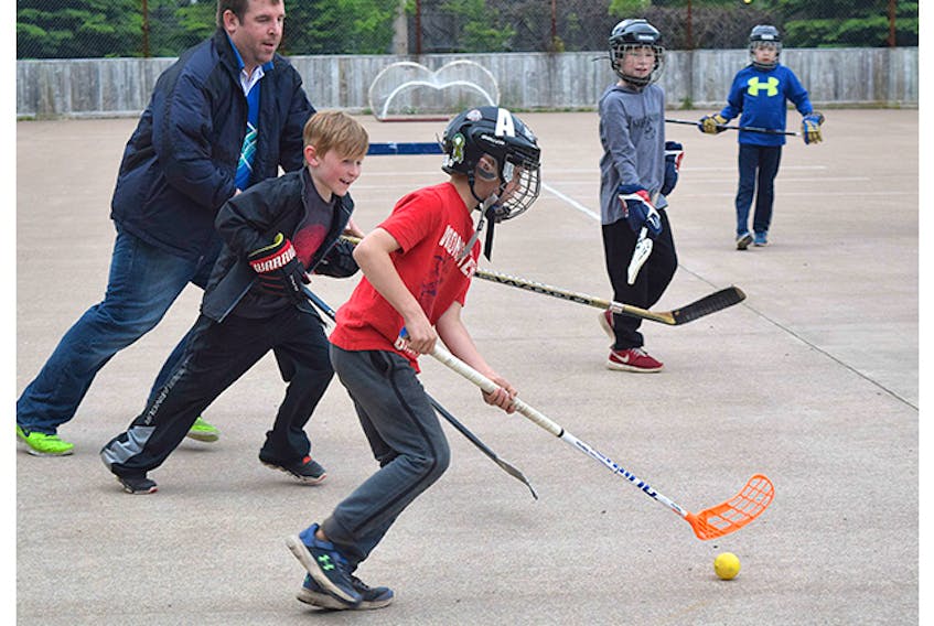 Mason Patriquin is shown during a pickup ball hockey game at the West Side Community Centre.