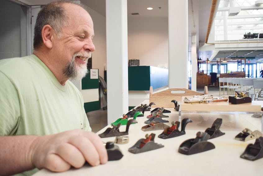 Scott Ross with a sampling of the child-sized tools that he has collected. The Atlantic Tool Collectors Association will be holding a tool show at the Museum of Industry in Stellarton this weekend.