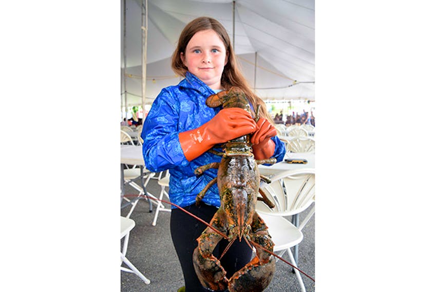 Nine-year-old Hannah Fleury, of Central Caribou, holds up Big Bubba.