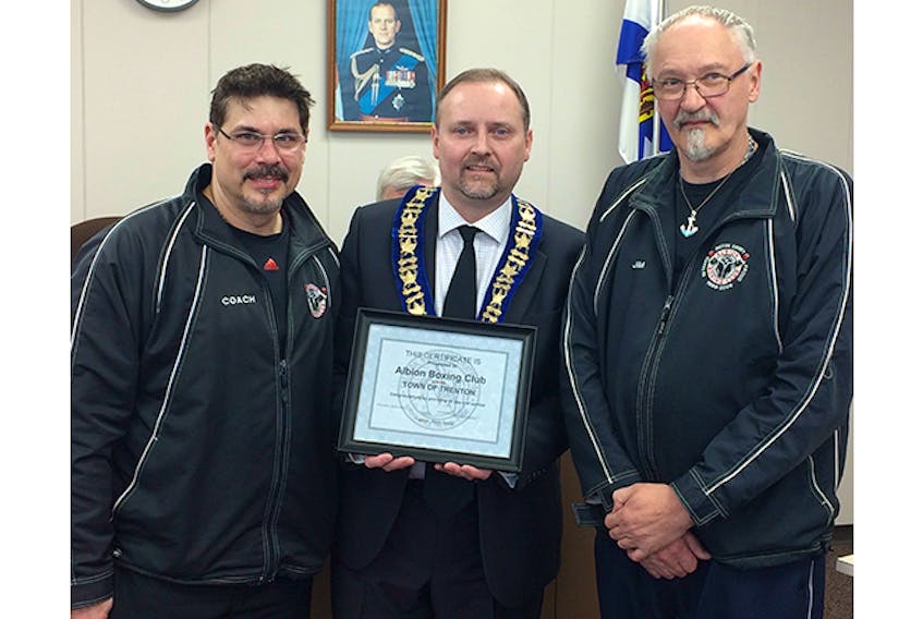 Trenton Mayor Shannon MacInnis presented a plaque this week to representatives from the Albion Boxing Club, to mark its 30th anniversary. Shown are head coach Al Archibald and club president Jim Worthen.