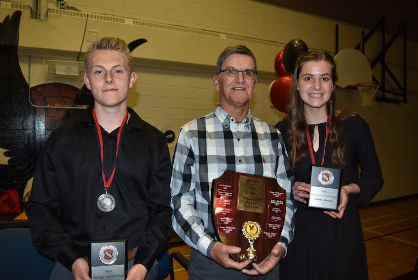 Martin Ryan is shown presenting the Jared Ryan Memorial Award to Northumberland Regional High School graduates Connor Boudreau and Danielle McKay.