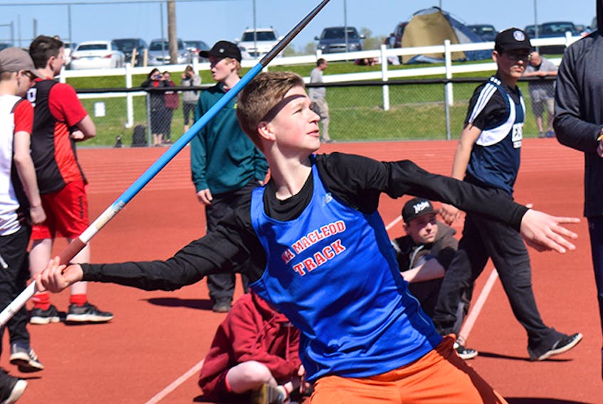 Nathanael King of Dr. W.A. MacLeod School heaves the javelin during track and field districts on Monday the Pioneer Coal track facility in Stellarton.