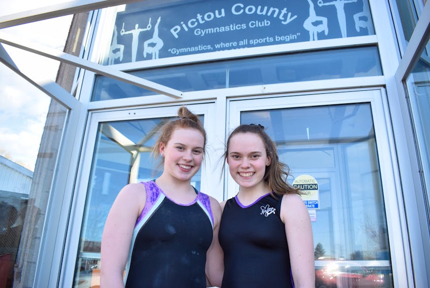 Josie Conrad, left, and her sister Abby Conrad outside the Pictou County Gymnastics Club in New Glasgow.