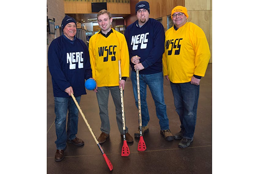 They are getting ready for the 8th Annual Jean Proudfoot Memorial Broomball Challenge. From left are: North End Recreation Centre coach Clyde Fraser, West Side Community Centre team chairman Nick Fraser, Ryan Murphy, vice-president of the board with the NERC, and Broomball Challenge committee member Frank Proudfoot.