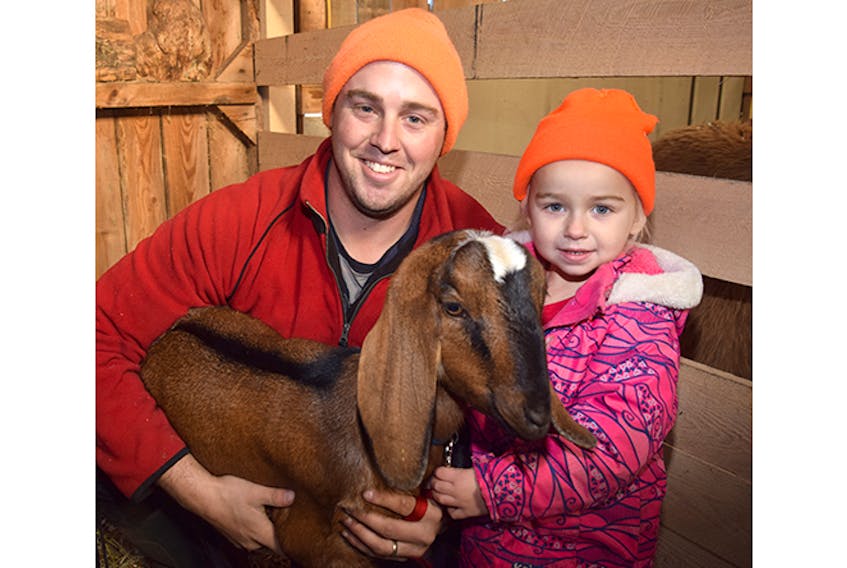 Brian Affleck and his daughter Autumn with Louise, a goat that until Tuesday had evaded capture for five weeks.