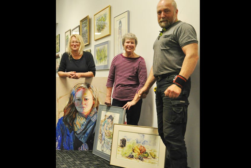 Local artists Joan Krawczyk, Carolyn Ritchie Bedford and Todd Vassallo were at the Museum of Industry, setting up a collection of local art for one of many exhibits Pictou County’s newest art collective, Art At Large, has planned.