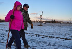 Tom and Isabel Davis enjoy a winter hike in Acadia Park, in Westville.