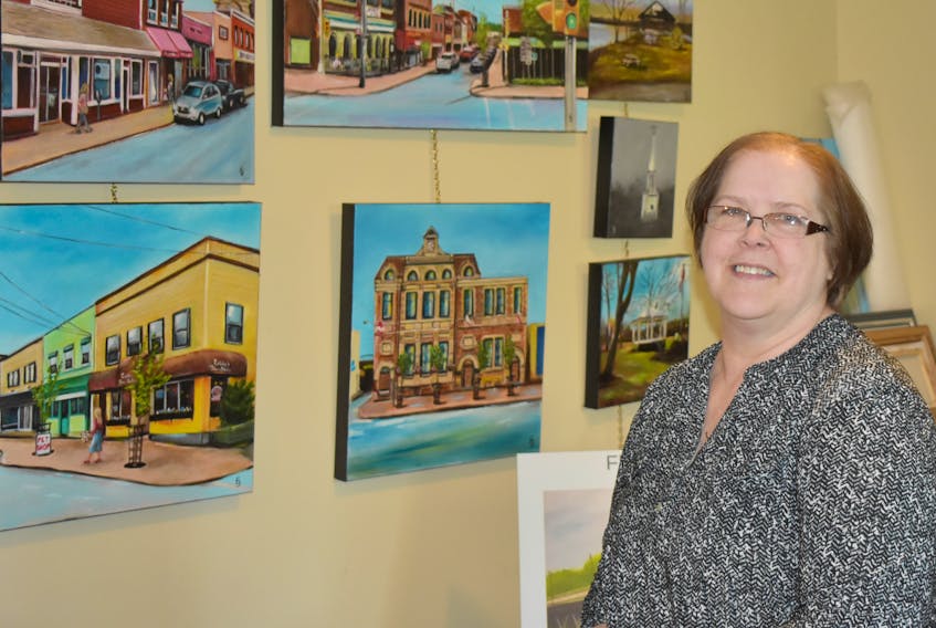 Sheila Green, with her newest collection of paintings entitled Flourish: a Collection. The 12 paintings – along with several supplemental paintings – depict the beauty of the Town of New Glasgow.