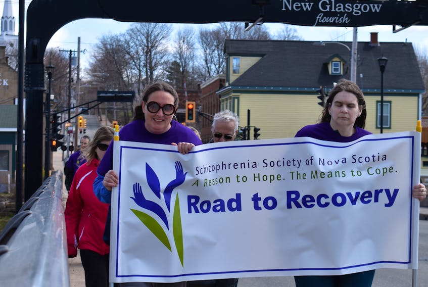 People participating in the Road to Recovery Walk in New Glasgow on Saturday.