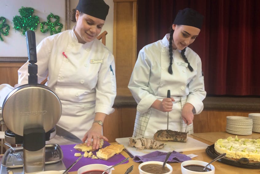 Students with the Restaurantworx recently held an appreciation brunch for local employers who participated in the program. Here, from the left, chef instructor Pamela MacDonald and student Sara-Lee Loveman help prepare the brunch.