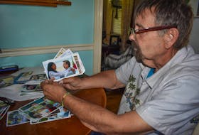 Bill MacArthur sits in his Rose Avenue home in Trenton and shows a picture of his wife in Jamaica. They’ve been trying since 2016 to get her a permanent residency visa to be able to move to Canada but have been denied.