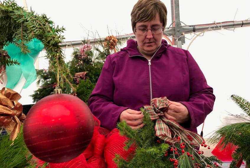 Patsy Chapman, owner of Nature’s Nook and Kranny, a business that was selling Christmas wares at the New Glasgow’s Farmer’s Market this past weekend.