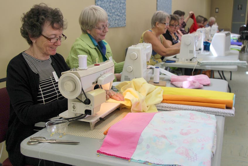 Allison Arsenault, left, and Dorothy Bush, were just a few of the 43 volunteers who showed up Friday to Pictou United Church to make whimsical pillowcases for the Aberdeen Hospital and IWK Children’s Hospital in Halifax. The cases were made for Ryan’s Case for Smiles which has volunteers, including those at Pictou United, make pillow cases to help bring a smile to sick child’s face.