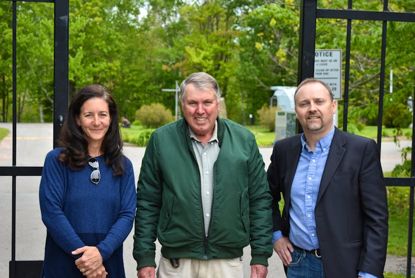 Jen Bethell with the Hemlock Group, Pictou County Warden Robert Parker and Trenton Mayor Shannon MacInnis, stand outside Trenton Park on Monday morning after the county announced financial support for the park’s revitalization.