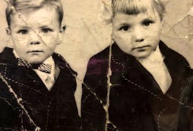 Kathy and John are pictured together as children. The photo was given to her by relatives who she connected with by sending in her DNA to be tested on a genealogical site.