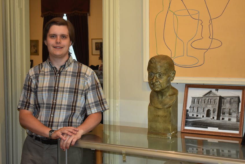 James Lees, summer curator for the Carmichael Stewart House Museum on Temperance Street, with a bust of George Archambeau, one of the sculptures created by John A. Wilson in 1932. Wilson will be one of several artists whose work is featured at the museum this summer.