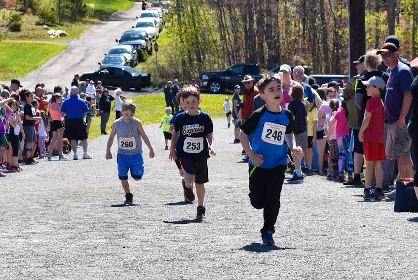 Young runners in the Bobby Gill Memorial, Cromwell Memorial, Paul MacDonald Memorial and William Tanner Memorial races were among the many people of assorted ages who participated in the Joe Earle Road Races, in Trenton on Monday.