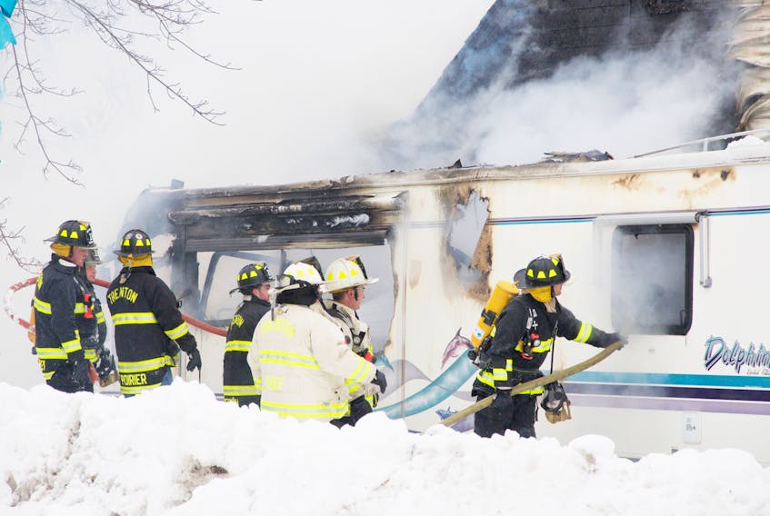 Trenton firefighters, with assistance from New Glasgow and Abercrombie, fight a fire at a home in Trenton on Tuesday.