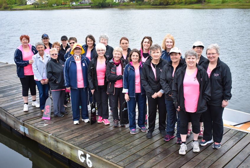 The ladies of the ABreastAhoy Dragon Boat Team lined up on the wharf in New Glasgow just before their Saturday afternoon practice.