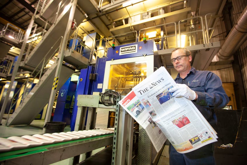 Ross Gagnon, assistant foreman and press operator at the Bluewater printing plant, sorts through the June 29th edition of The News. Today is the final daily edition of newspaper. The first weekly will be delivered on Thursday, July 5.