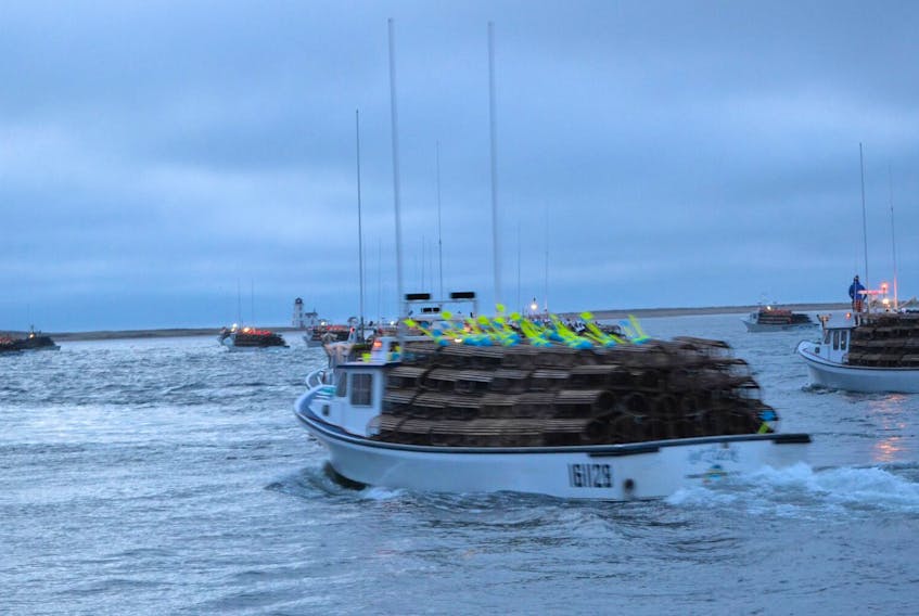Lobster boats, loaded with gear, sail out of Alberton Harbour on setting Day, April 29. Next year, if a measure fishermen voted in favour of is approved, fishermen will see the minimum carapace size of their lobsters increased by a millimetre.
