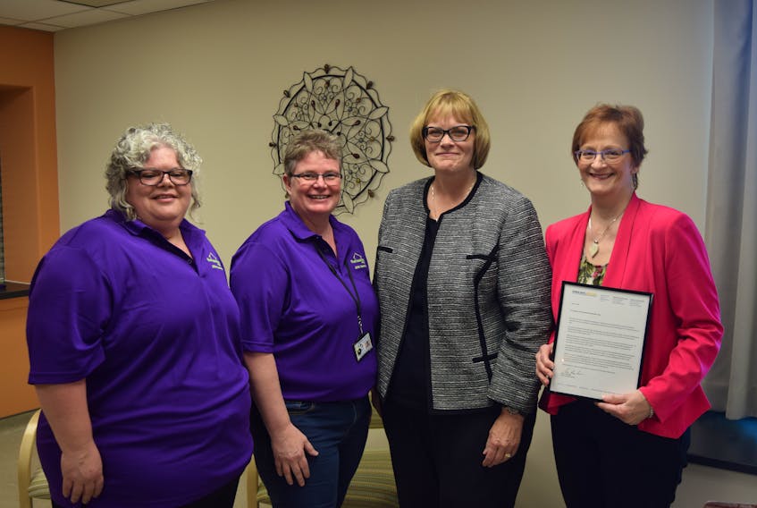Monica King, left, Patty Slaunwhite – co-chairs representing the labour and management respectively – and CEO Patricia Bland, right, with Riverview Home Corp., accept a workplace recognition award from Shelley Rowan, second from right. Rowan, vice president of prevention and service delivery with the Workers’ Compensation Board of Nova Scotia, visited the Riverton-based care facility on May 8 to present the award for their progress in improving workplace safety.