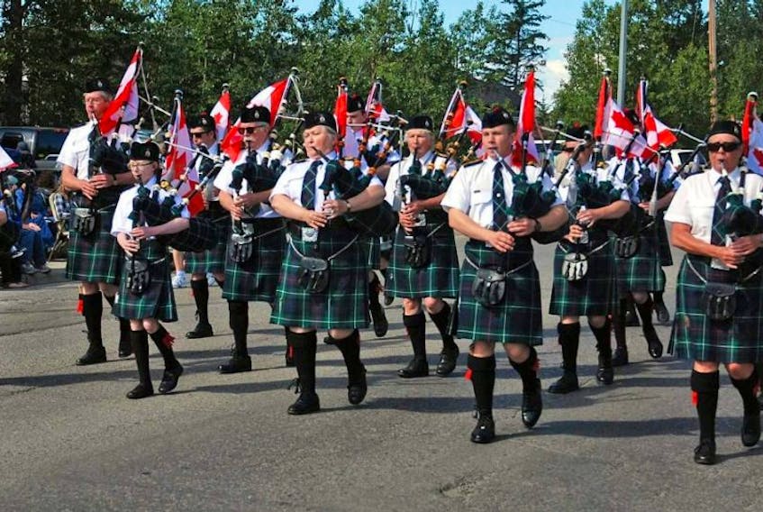 The Innisfail Legion Pipe Band is shown performing in a parade in its Alberta hometown earlier this year. Sylvia Morison, originally from Westville, is the third piper from the left.