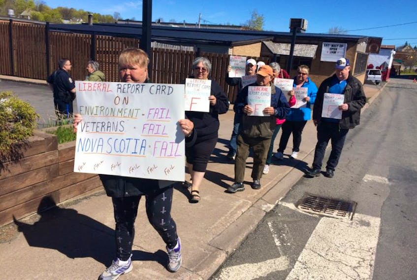 Protesters with the Trenton-Hillside Environmental Watch marched near the office of Central Nova MP Sean Fraser Wednesday. The group wants the federal government to pressure provincial governments to do more to stop emissions from coal-fired generating plants such as Nova Scotia Power in Trenton.
