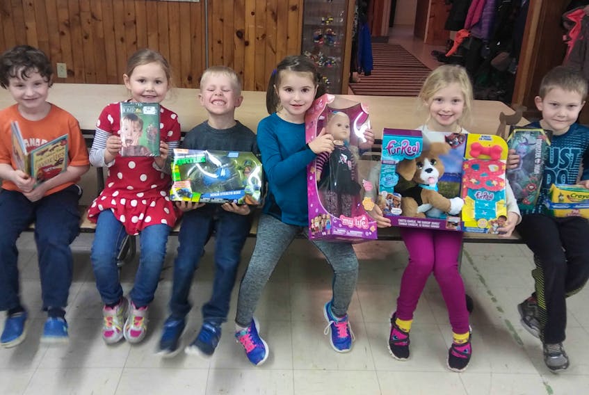 Shown with some of the many items purchased with funds raised by the Westside after-school program are from left: Austin Gammon, Avyn MacDonald, Patrick Hayward, Sophie DeBlois, Avery Gill and Daniel Chisholm.