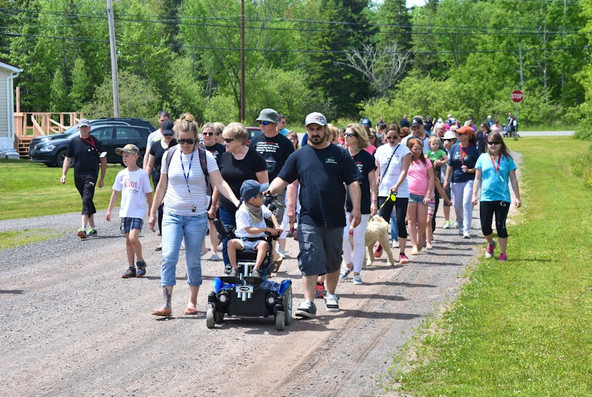 Participants in the 2018 Walk for Muscular Dystrophy make their way toward the Trans-Canada Trail in Scotsburn.